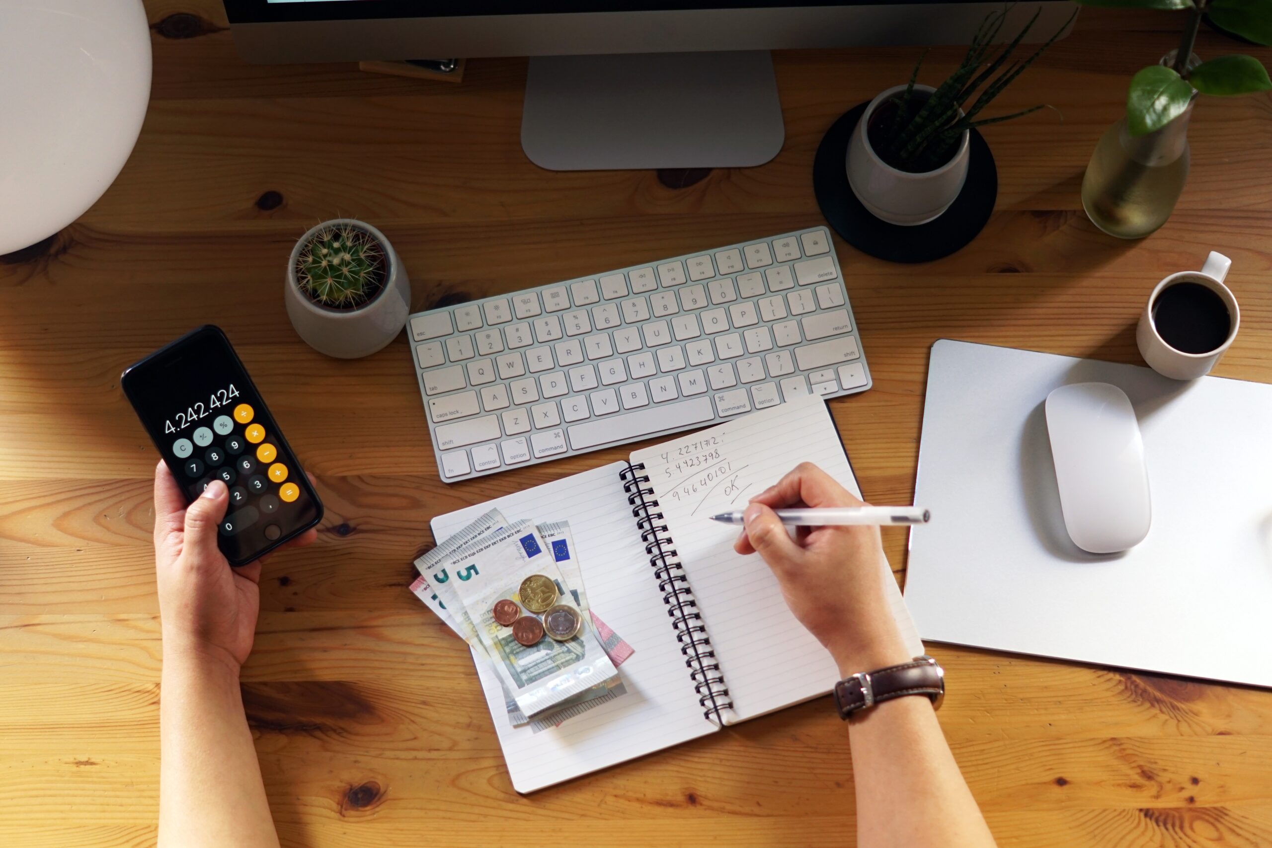 closeup shot entrepreneur working from home his personal finances savings scaled
